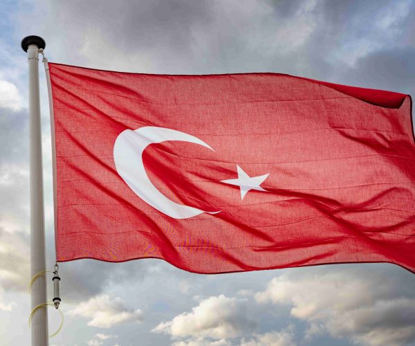 turkey-flag-waving-against-cloudy-sky